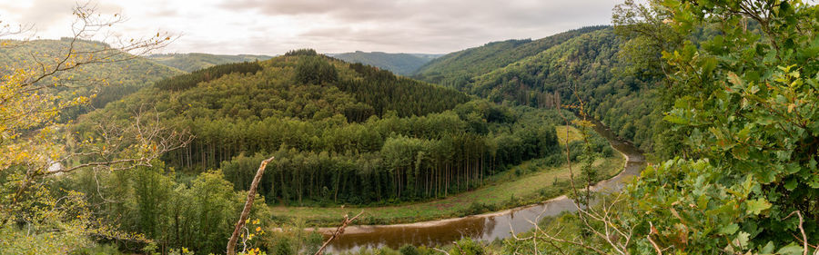 Panoramic shot of land and mountains against sky