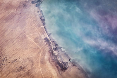 View of land against cloudy sky