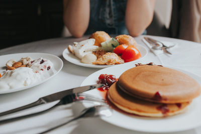 Close-up of breakfast served on table