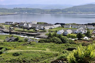 High angle view of townscape by sea