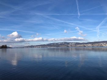 Scenic view of sea against blue sky