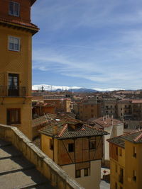 Houses in town against sky