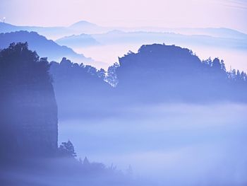 Scenic view of mountains against sky during sunset