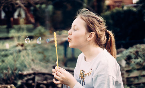 Girl looking at bubbles