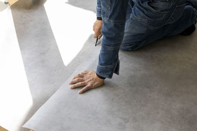 Low section of woman walking on floor