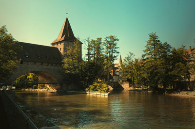 Bridge over river against clear sky