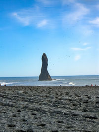 Scenic view of sea against blue sky