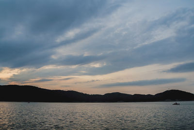 Scenic view of lake against sky during sunset