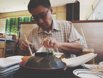 Man preparing food in restaurant