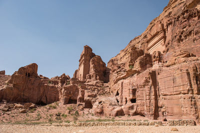 Scenic view of rock formations against clear sky