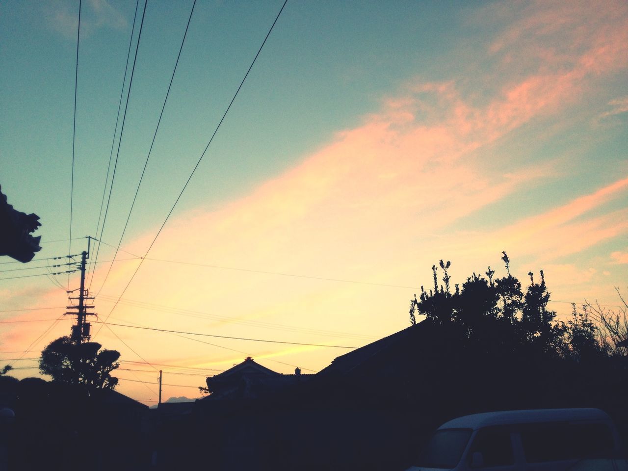 power line, silhouette, sunset, electricity pylon, low angle view, sky, cable, electricity, power supply, connection, built structure, architecture, building exterior, tree, technology, power cable, cloud - sky, orange color, fuel and power generation, dusk