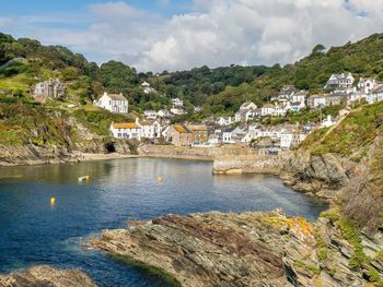 A calm bright day at the inlet of polperro in cornwall, uk