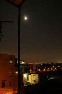 Illuminated street light at night