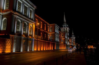 Illuminated buildings in city at night