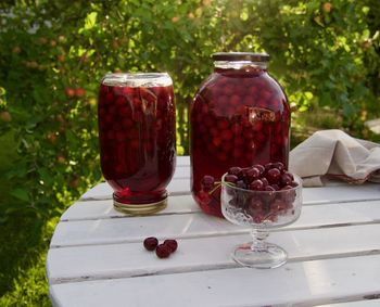 Fruits in glass jar on table