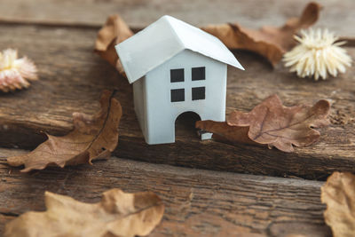 Close-up of model house on wooden table