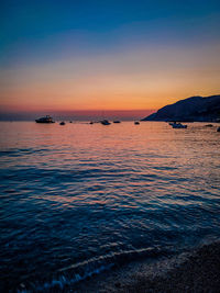 Scenic view of sea against sky at sunset