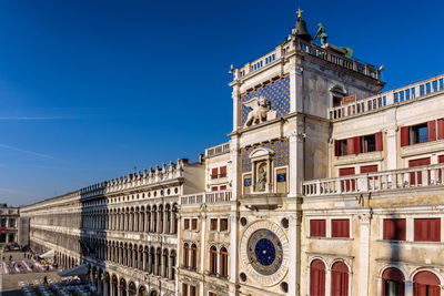 Low angle view of building against blue sky