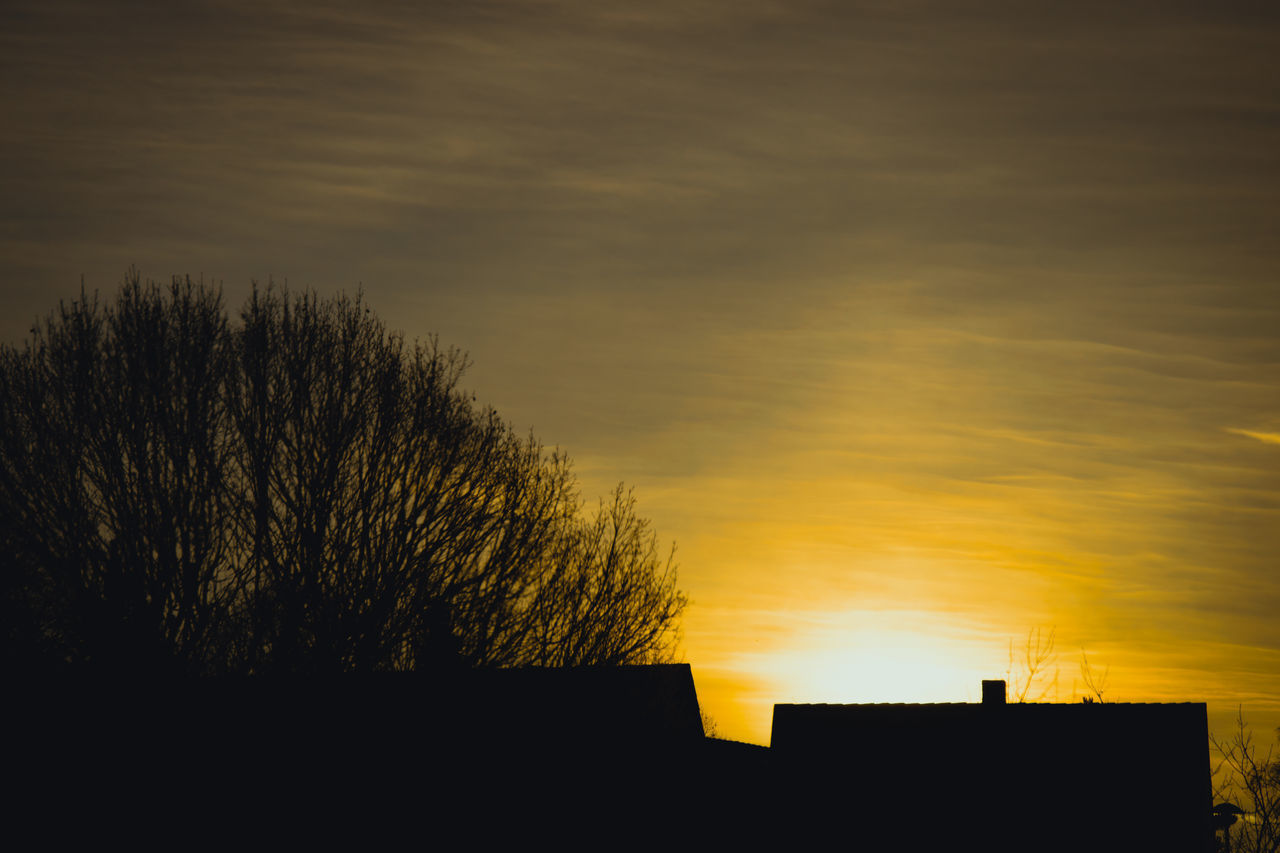 LOW ANGLE VIEW OF SILHOUETTE BUILDING AGAINST SKY DURING SUNSET