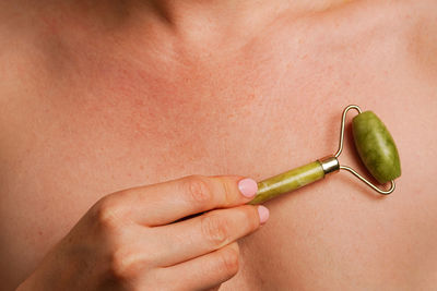 Cropped hand of woman holding knife