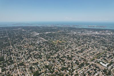 High angle view of city buildings against sky