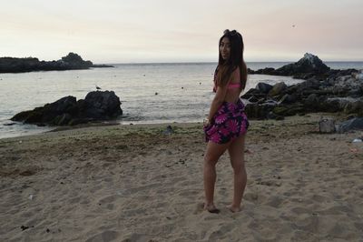 Full length of woman on beach