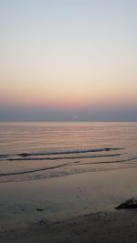 Scenic view of sea against clear sky during sunset