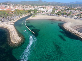 High angle view of cityscape by sea