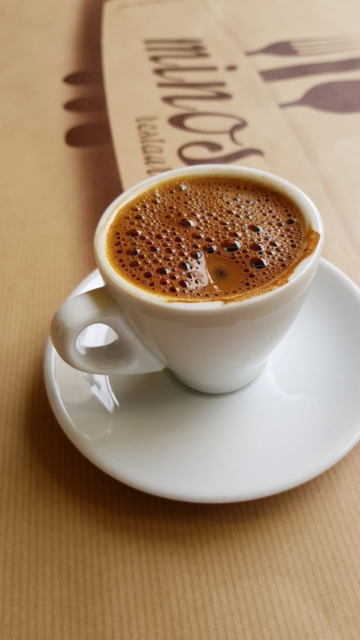 COFFEE CUP ON TABLE