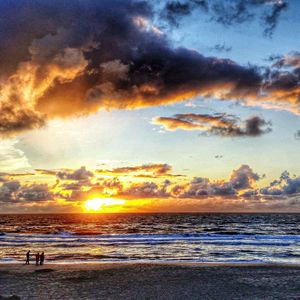 Scenic view of sea against cloudy sky