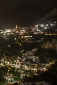 High angle view of illuminated buildings in city at night