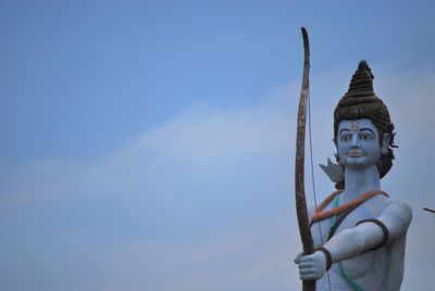 Low angle view of statue against sky