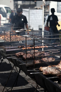 Man preparing food on barbecue grill