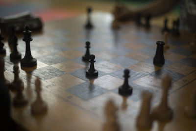 Close-up of chess pieces on table