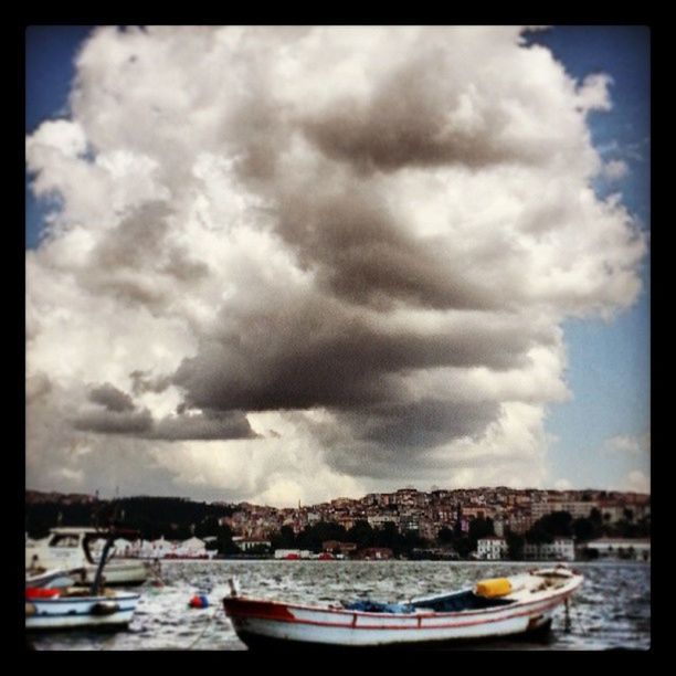 sky, transfer print, water, cloud - sky, nautical vessel, cloudy, auto post production filter, boat, cloud, moored, sea, transportation, mode of transport, waterfront, tranquil scene, scenics, nature, day, tranquility, beauty in nature