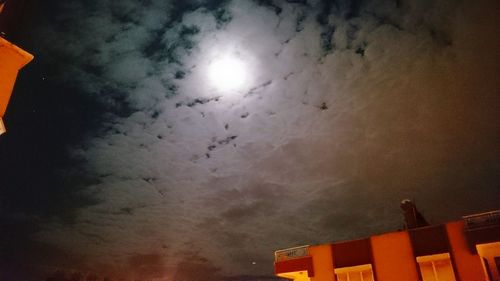 Low angle view of building against cloudy sky