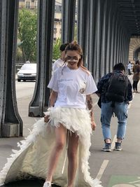 Full length of woman standing in front of building