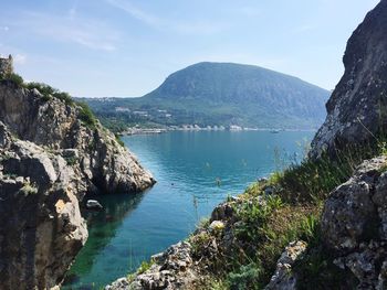 High angle view of lake by mountains