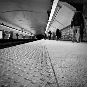 People waiting at railroad station platform