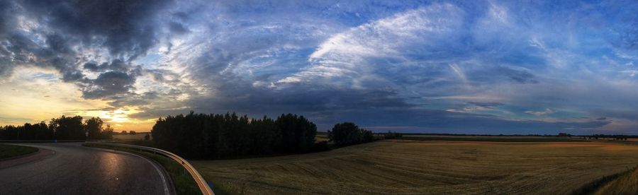 Scenic view of road against sky during sunset