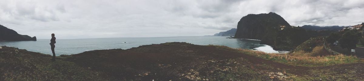 Scenic view of sea against cloudy sky