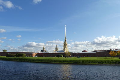 View of bridge over river against cloudy sky