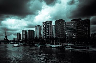 Cityscape against cloudy sky