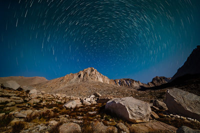 Scenic view of mountains against sky at night