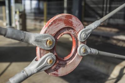 Close-up of rusty pipe on railing