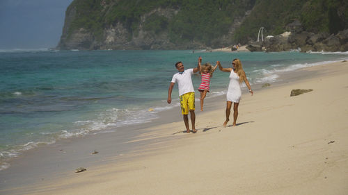 Family with child on the beach.