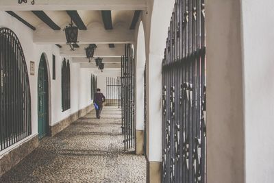 Man in corridor of building