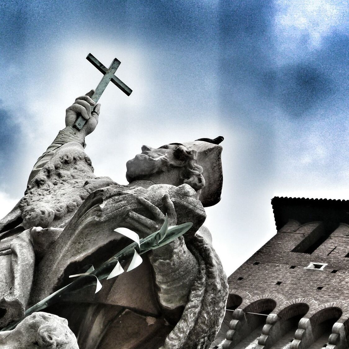 low angle view, sky, sculpture, statue, art and craft, art, human representation, creativity, cloud - sky, built structure, religion, old, history, architecture, building exterior, cloud, day, spirituality
