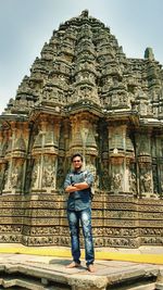 Full length of a buddha statue in temple