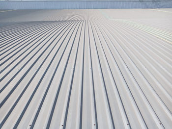 Photograph of a grey metal sheet part of a roof.